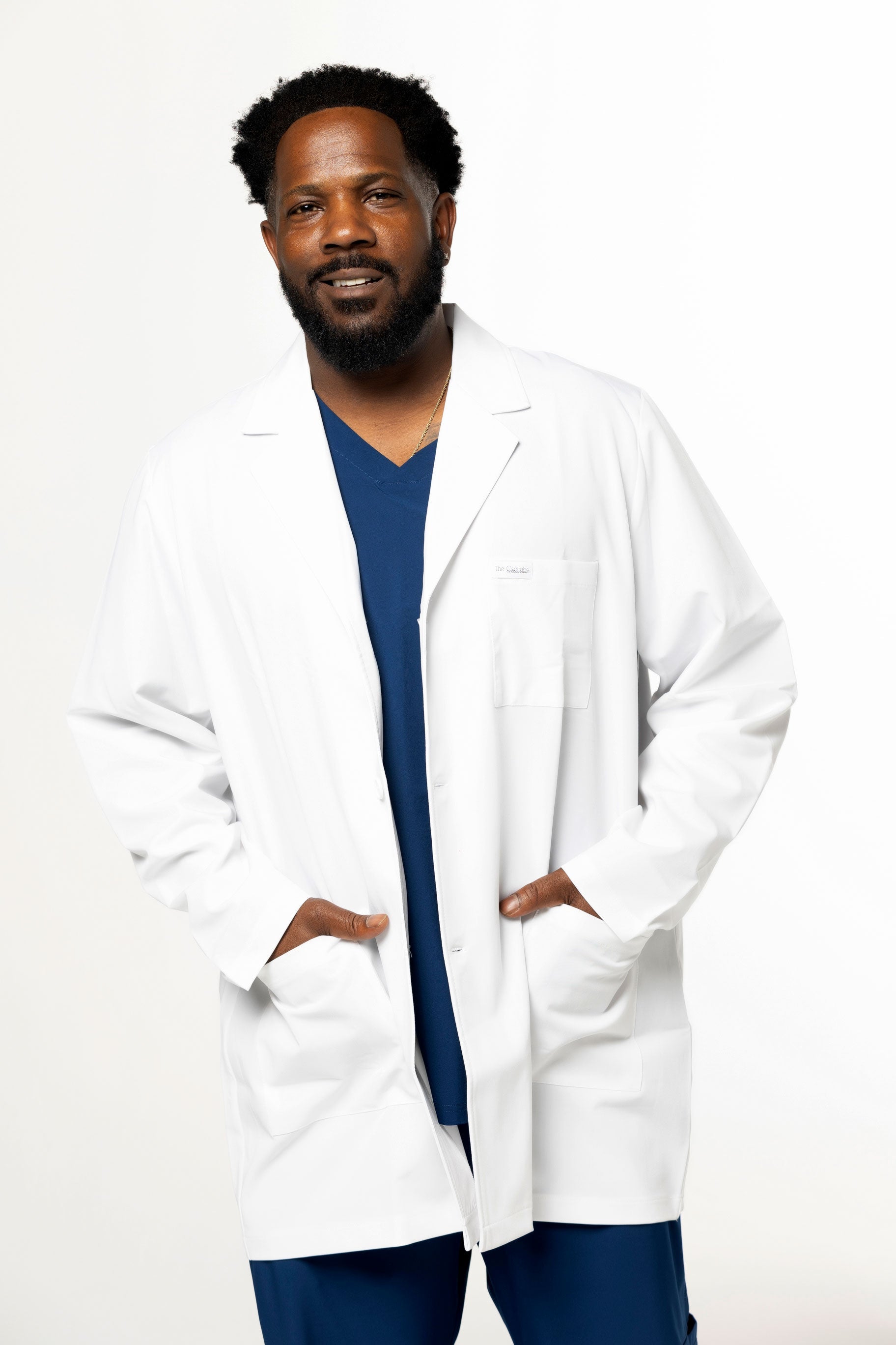 Men's lab coat, Professional attire, Medical wear, Scientific coat, Lab attire, Workwear, Tailored fit, Durable fabric, Multiple pockets, Button-front closure, Notched collar, Professionalism, Sophisticated, Functional design, Essential work garment, Comfortable wear, Professional appearance, Laboratory coat, Healthcare attire, High-quality craftsmanship