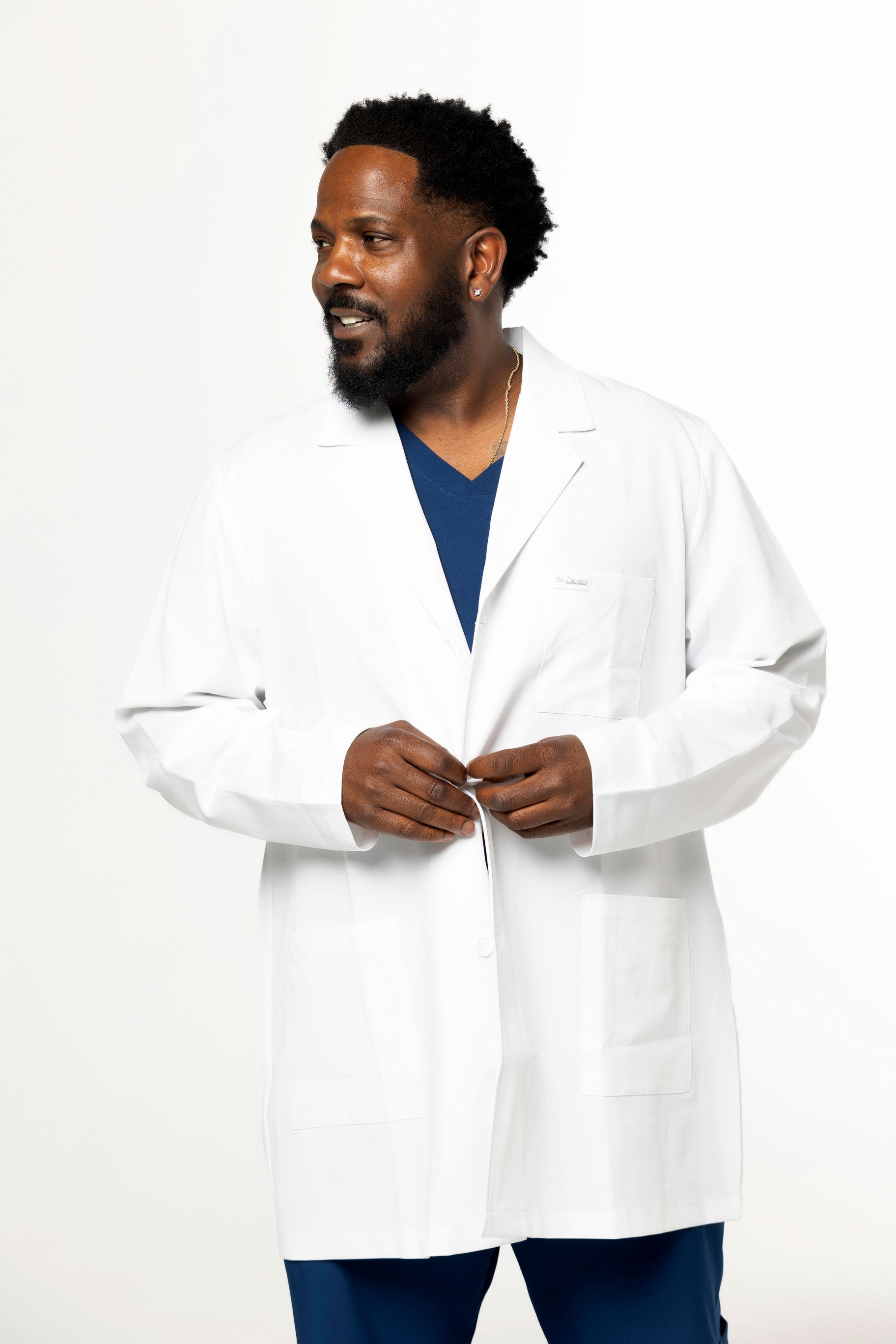 Men's lab coat, Professional attire, Medical wear, Scientific coat, Lab attire, Workwear, Tailored fit, Durable fabric, Multiple pockets, Button-front closure, Notched collar, Professionalism, Sophisticated, Functional design, Essential work garment, Comfortable wear, Professional appearance, Laboratory coat, Healthcare attire, High-quality craftsmanship